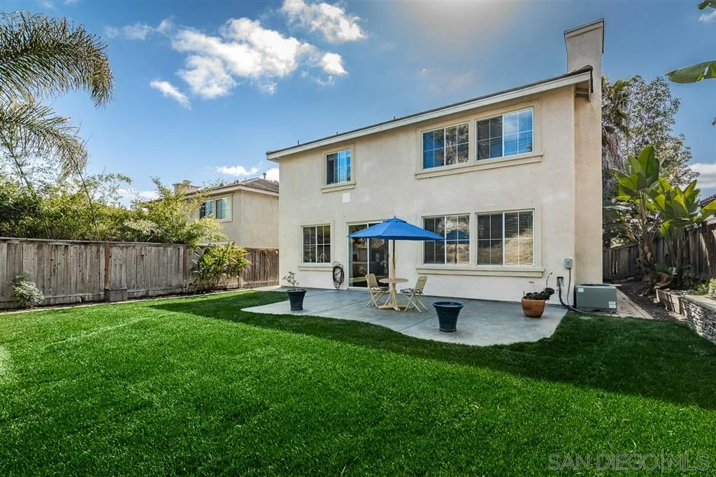1088 Greenway Road Oceanside, CA 92057 - Photo 21 of 25 a front view of a house with patio and garden