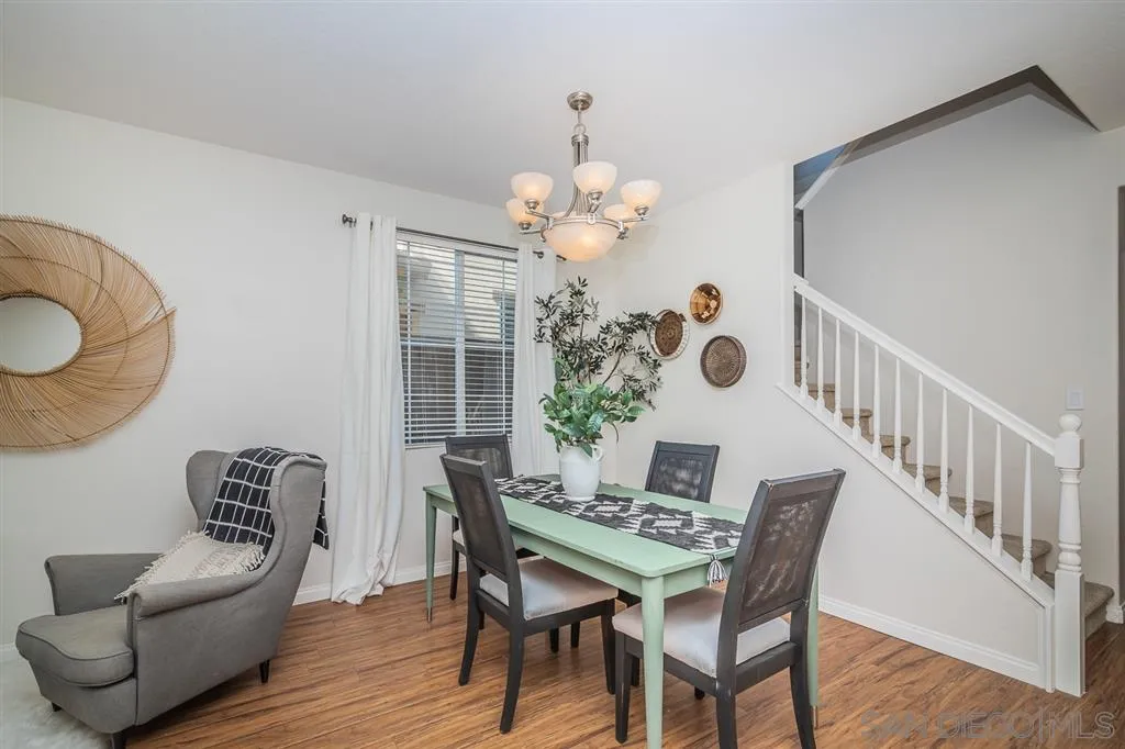 1088 Greenway Road Oceanside, CA 92057 - Photo 4 of 25 a view of a dining room with furniture and a chandelier