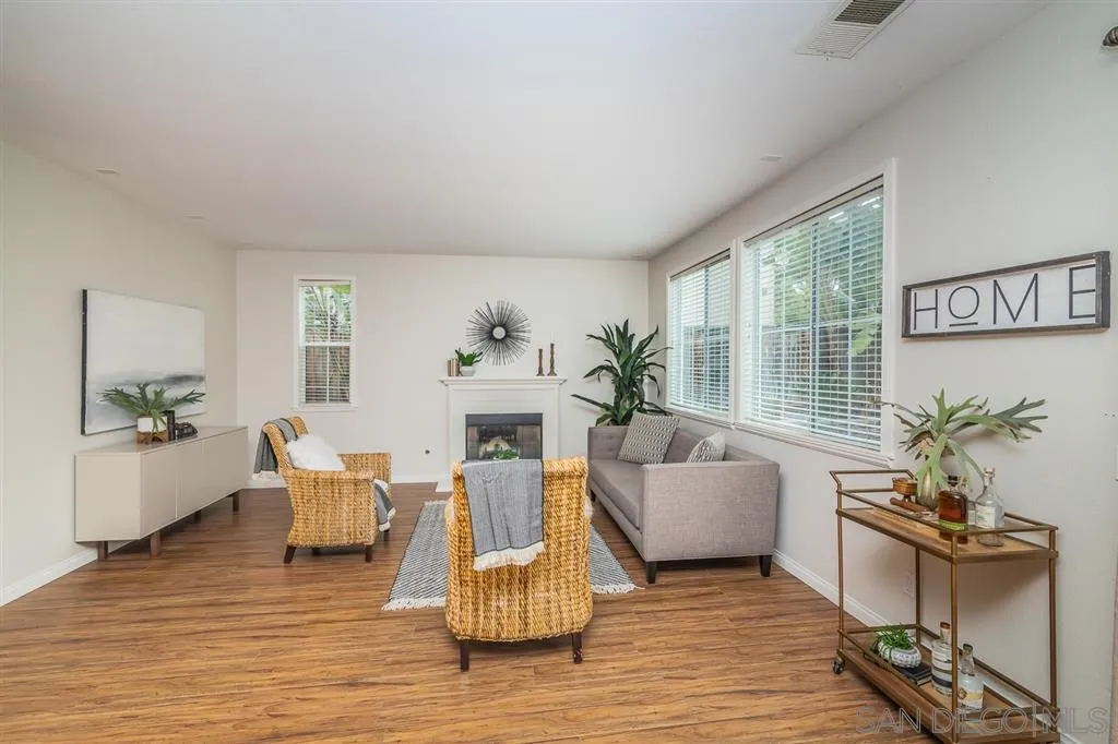 1088 Greenway Road Oceanside, CA 92057 - Photo 7 of 25 a living room with furniture and a wooden floor