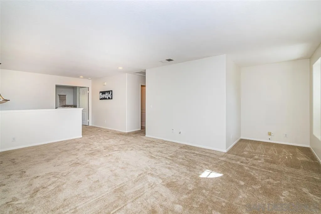 1088 Greenway Road Oceanside, CA 92057 - Photo 10 of 25 a view of an empty room with a kitchen
