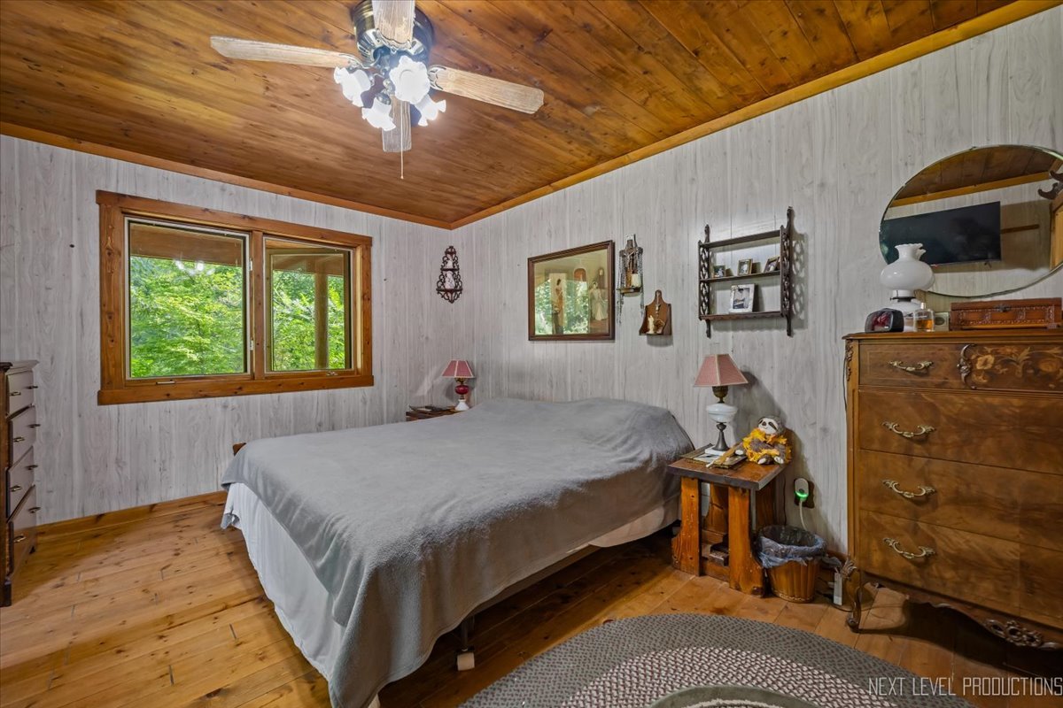 4002 East 1950th Road Sheridan, IL 60551 - Photo 12 of 35 a bed sitting in a bedroom next to a window