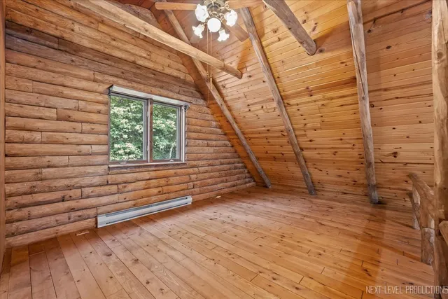 a view of room with window and ceiling fan