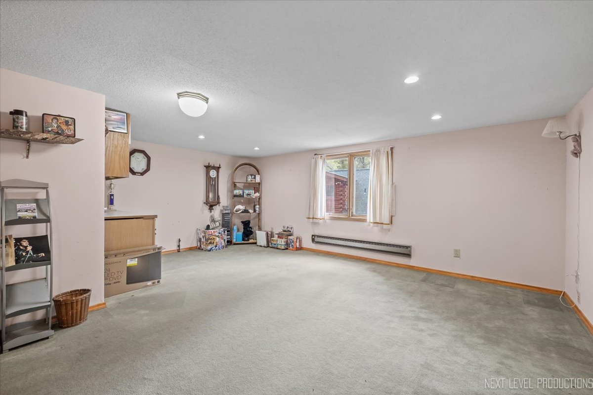 4002 East 1950th Road Sheridan, IL 60551 - Photo 22 of 35 an empty room with furniture and a window