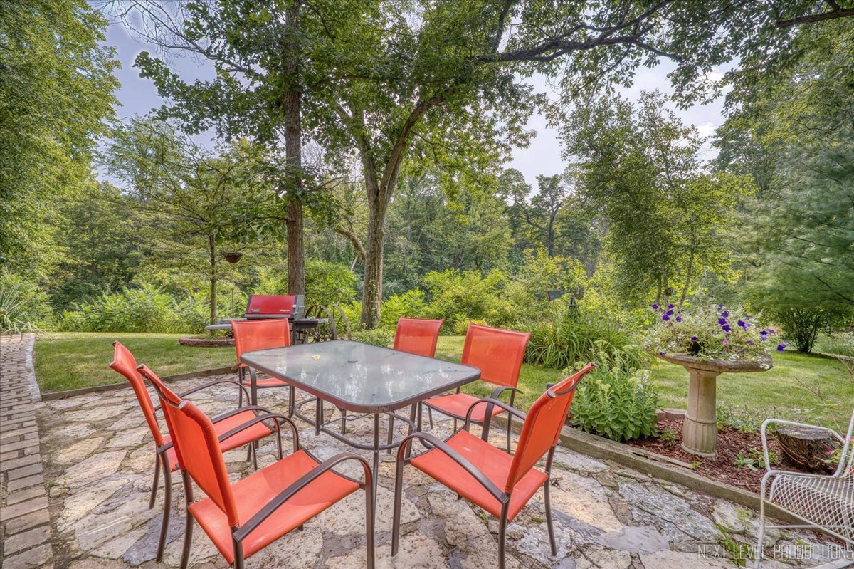 4002 East 1950th Road Sheridan, IL 60551 - Photo 30 of 35 a backyard of a house with table and chairs