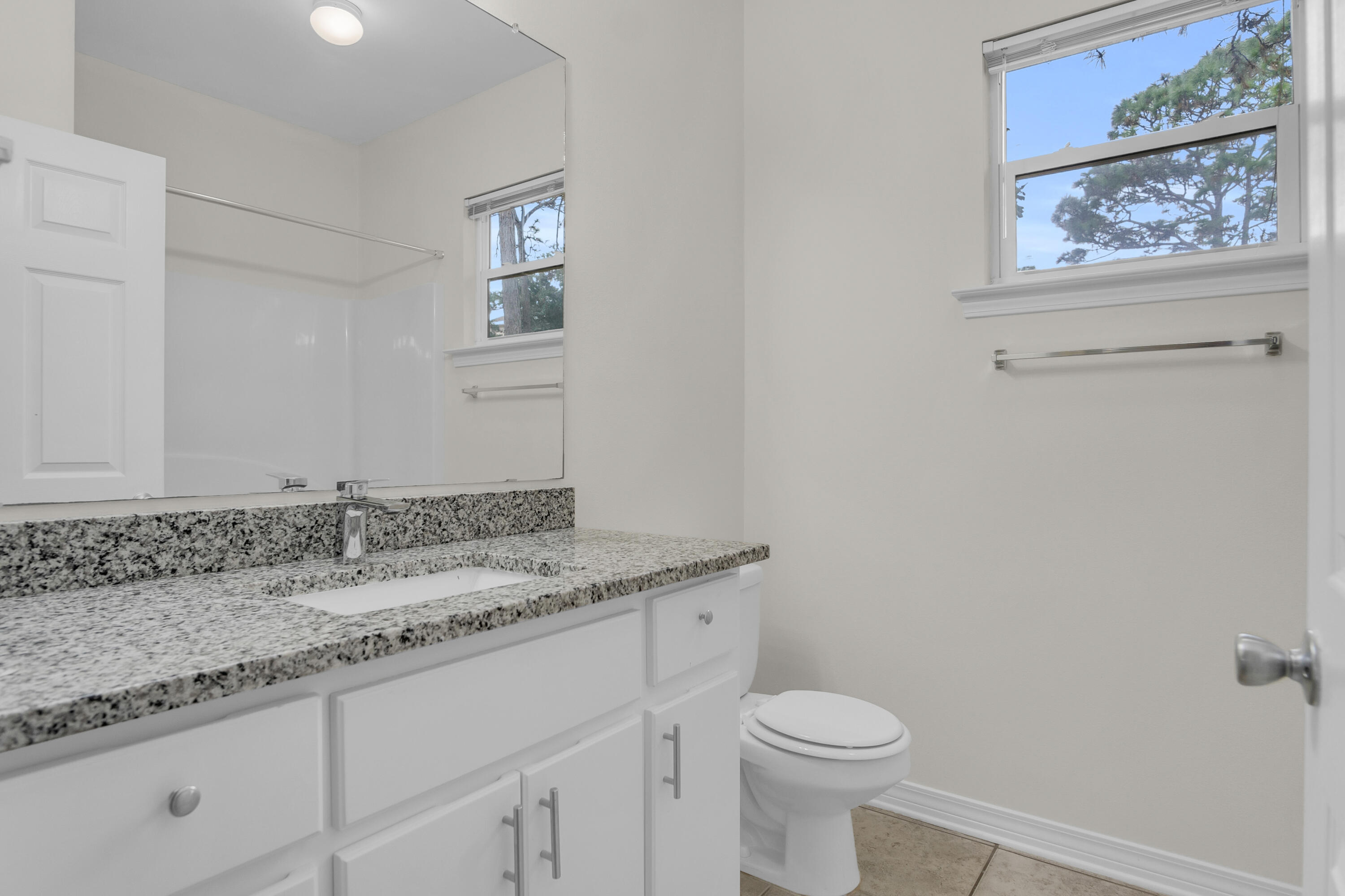 63 Las Roblas Grande Drive Santa Rosa Beach, FL 32459 - Photo 12 of 28 a bathroom with a granite countertop sink and a mirror