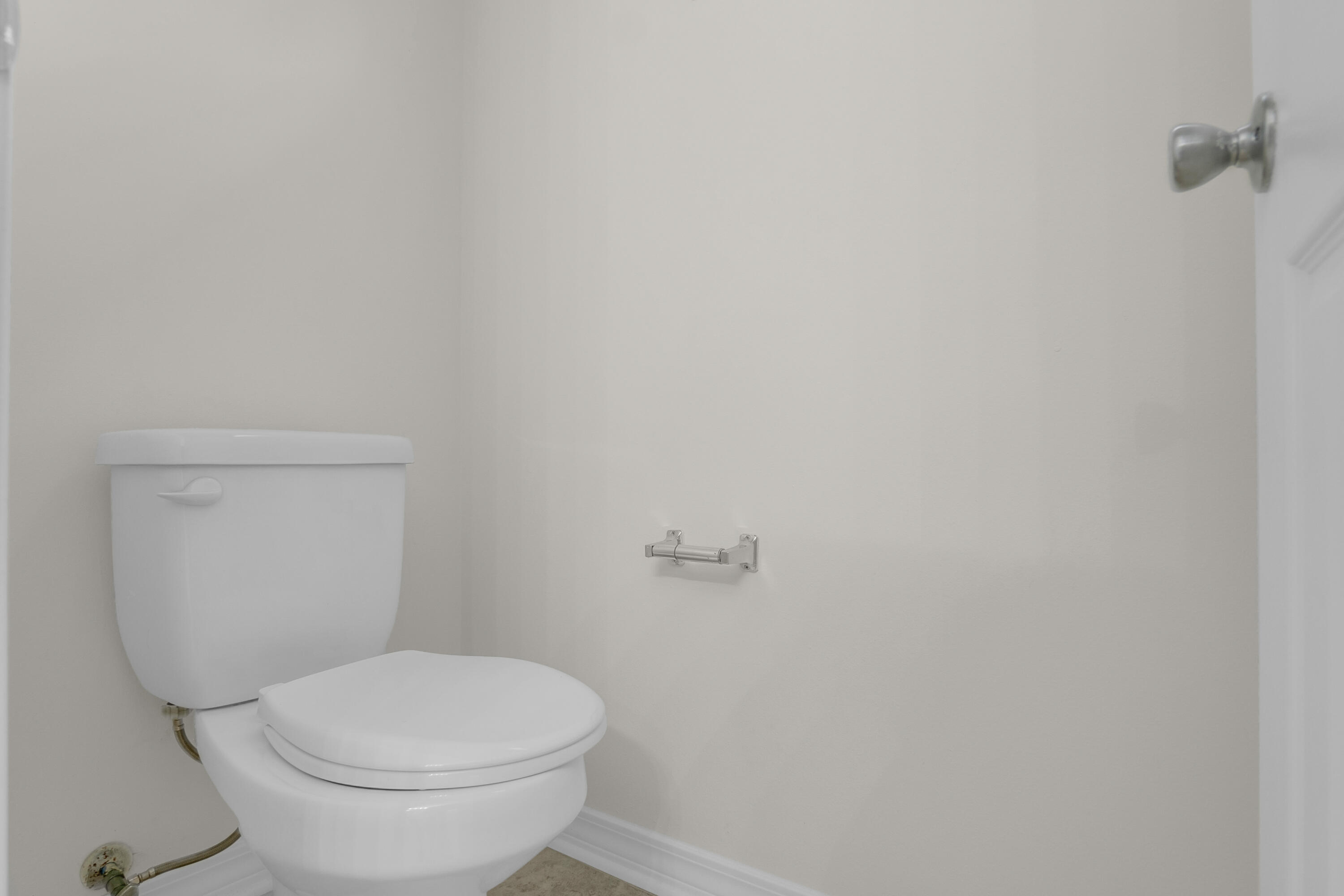 63 Las Roblas Grande Drive Santa Rosa Beach, FL 32459 - Photo 25 of 28 a white toilet sitting next to a white wall
