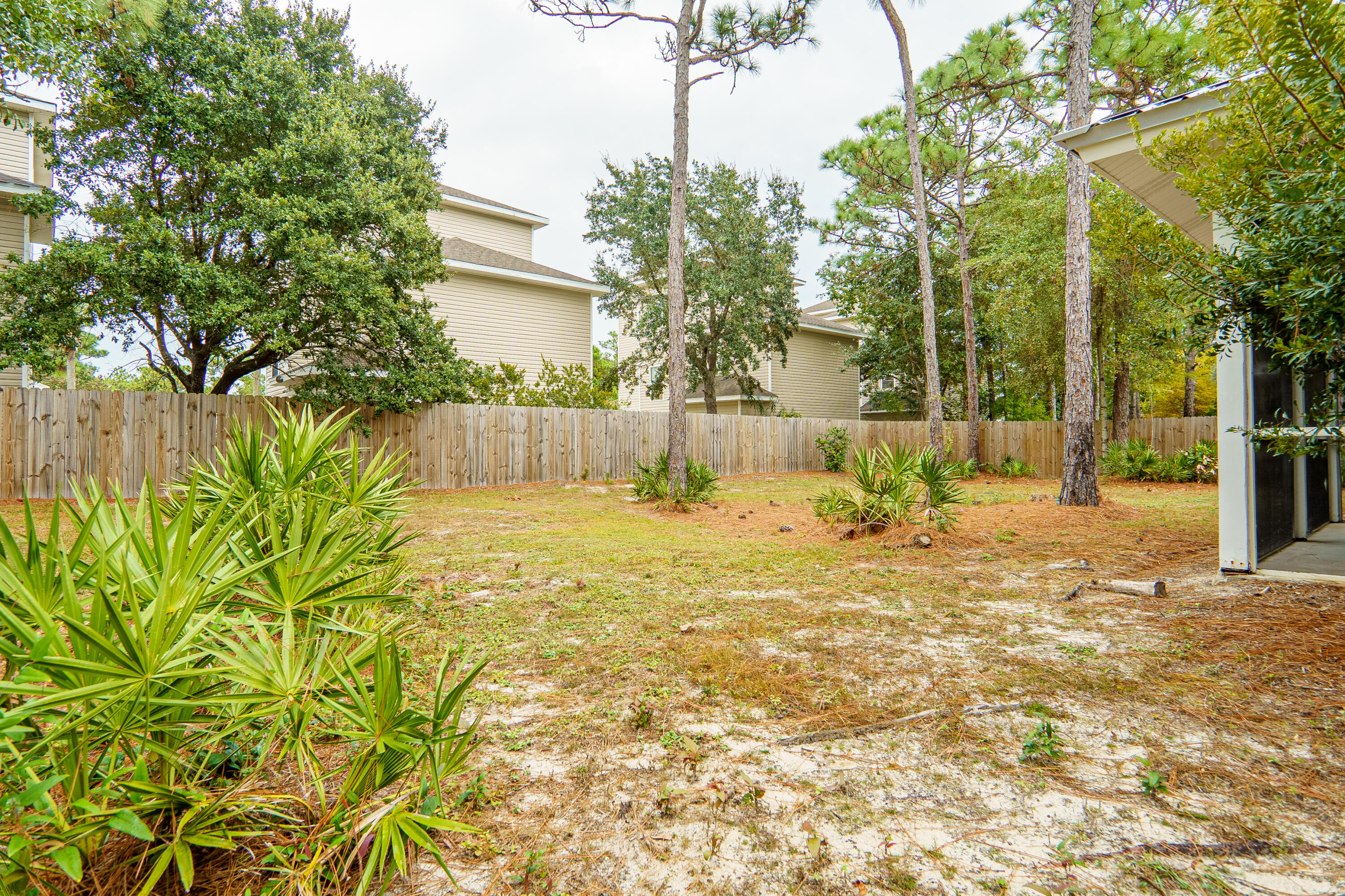 63 Las Roblas Grande Drive Santa Rosa Beach, FL 32459 - Photo 3 of 28 a view of back yard of the house