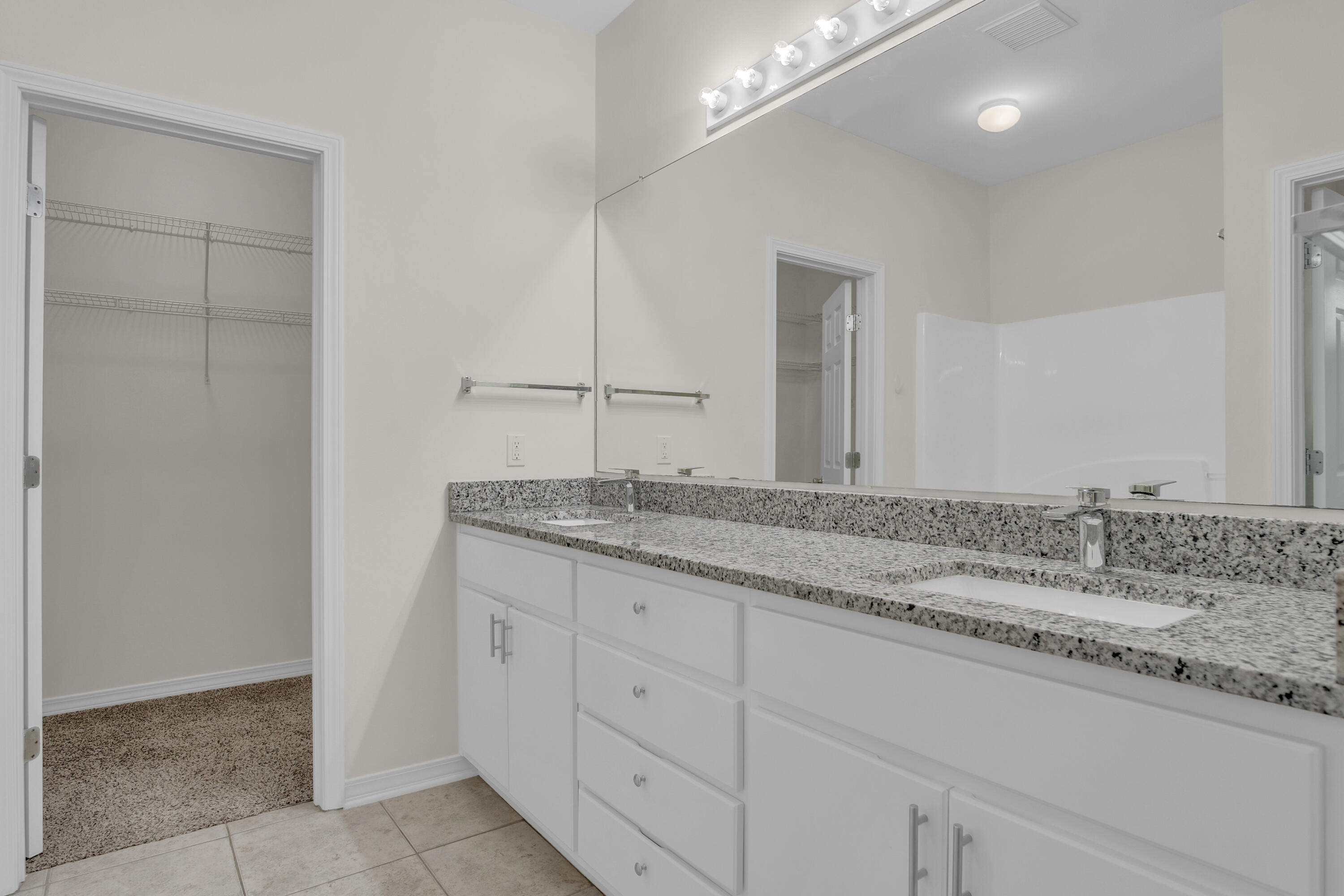 63 Las Roblas Grande Drive Santa Rosa Beach, FL 32459 - Photo 9 of 28 a bathroom with a granite countertop sink and a mirror