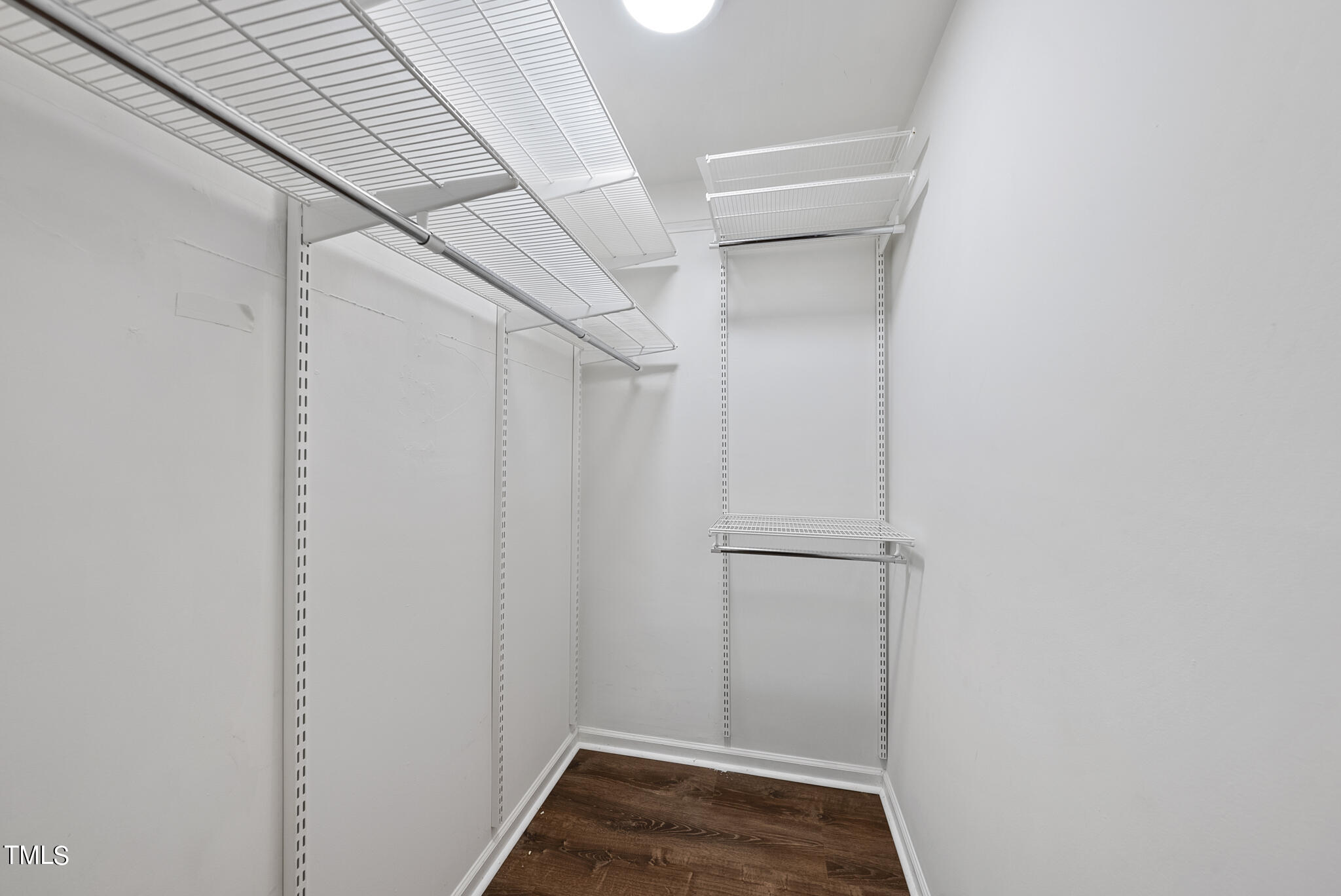 1309 Hillbrow Lane, Unit 103 Raleigh, NC 27615 - Photo 20 of 25 a view of storage and utility room with empty racks