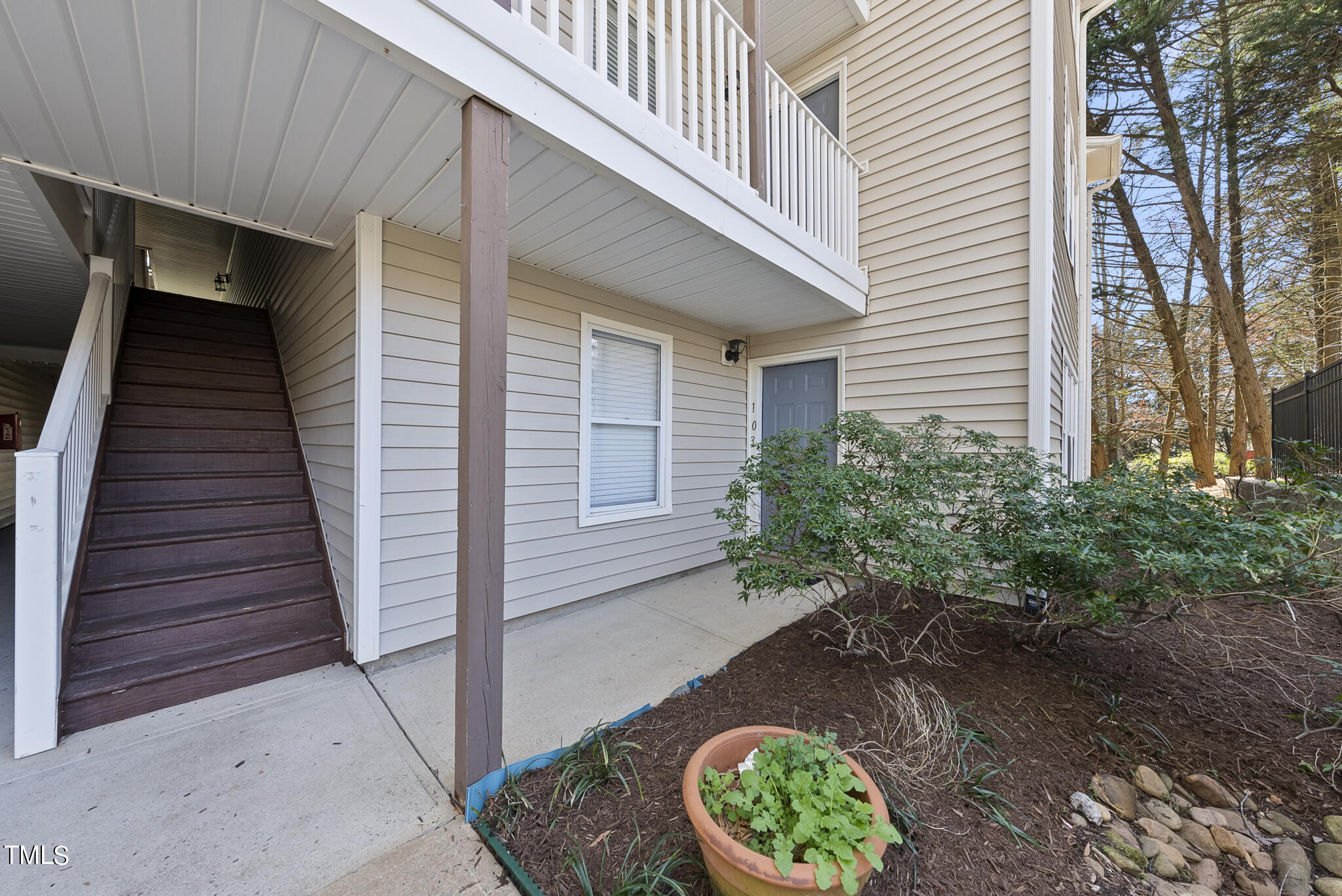 1309 Hillbrow Lane, Unit 103 Raleigh, NC 27615 - Photo 2 of 25 a view of a backyard with pathway