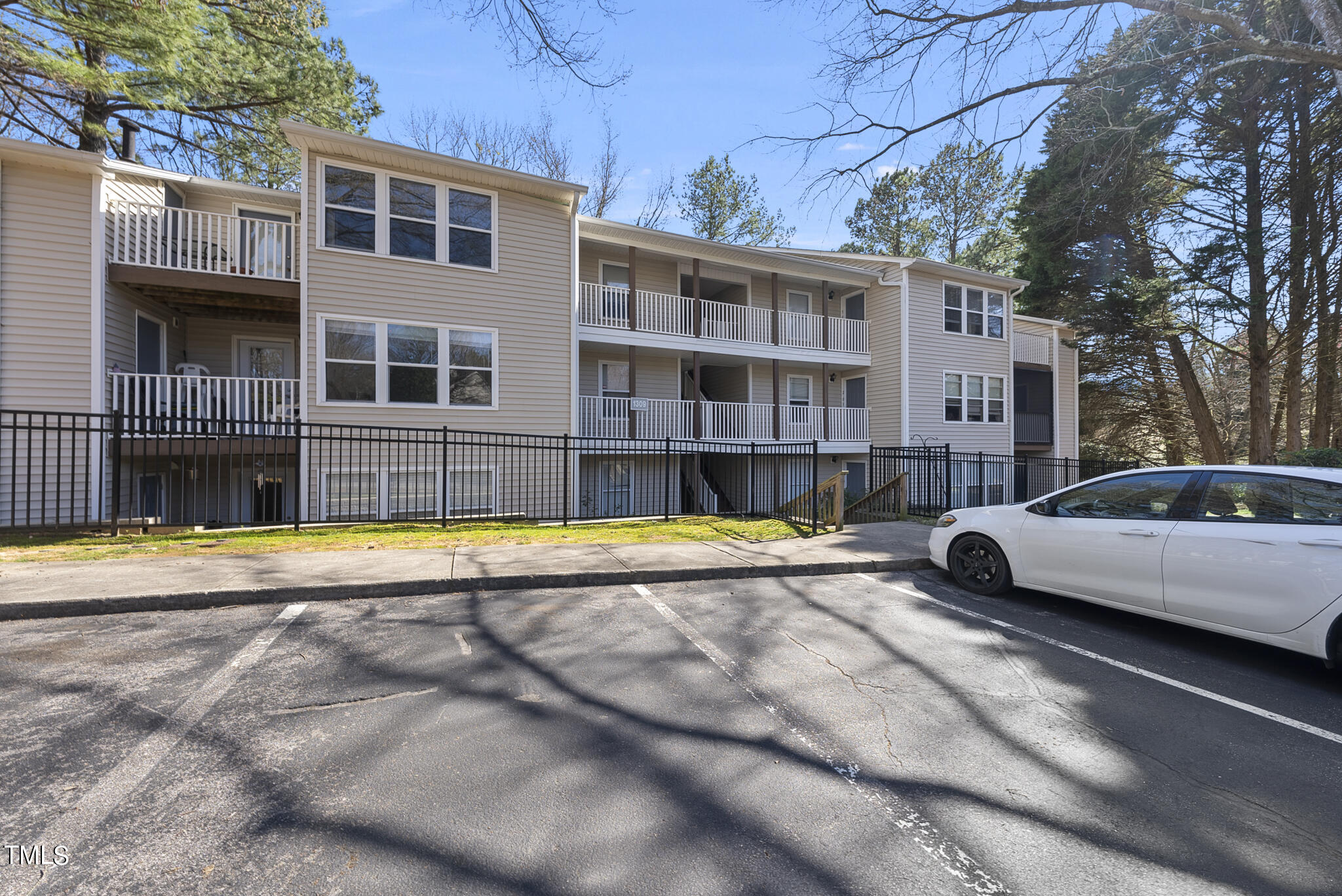 1309 Hillbrow Lane, Unit 103 Raleigh, NC 27615 - Photo 3 of 25 a view of a swimming pool with a lounge chair