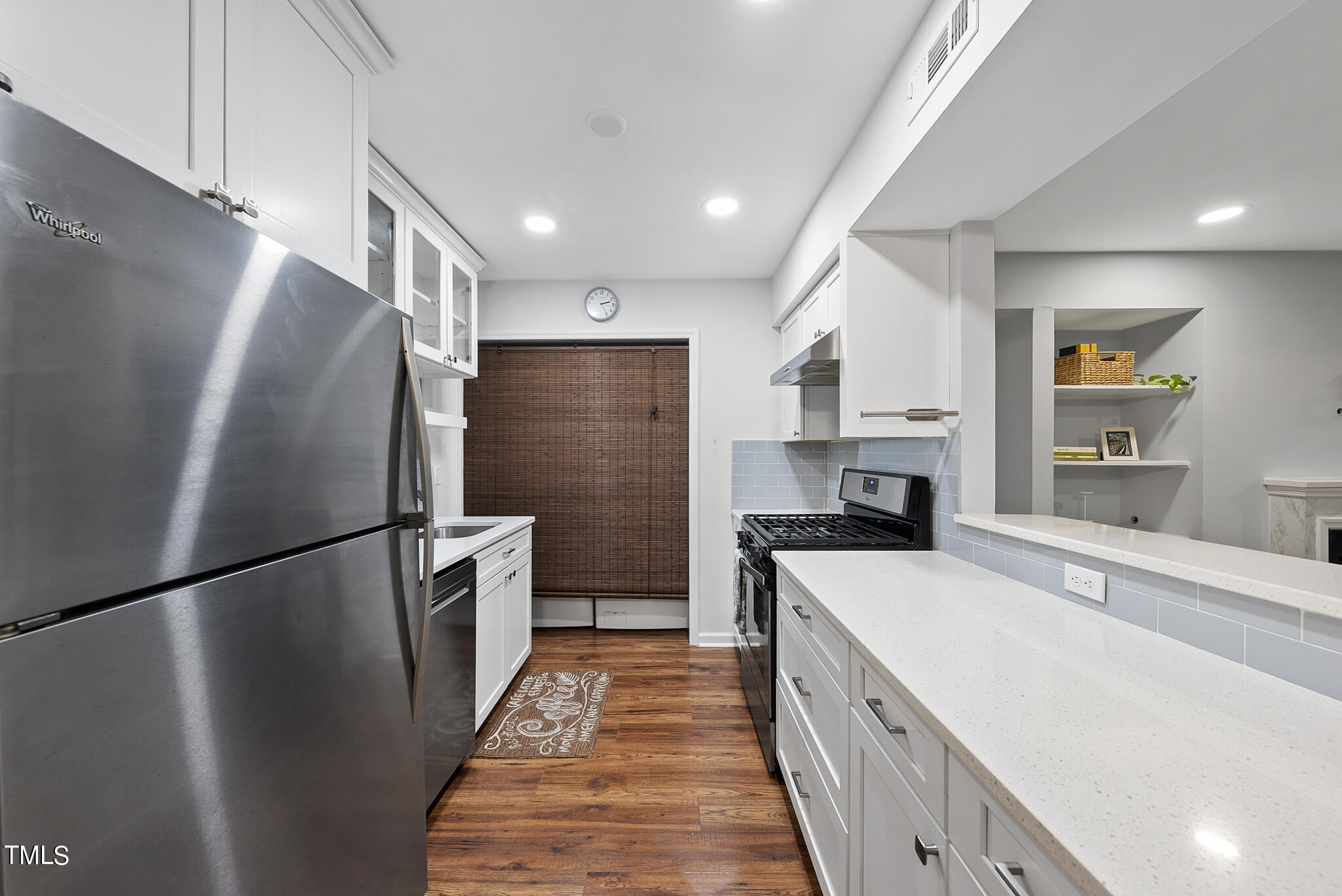 1309 Hillbrow Lane, Unit 103 Raleigh, NC 27615 - Photo 9 of 25 a kitchen with a refrigerator a sink and dishwasher