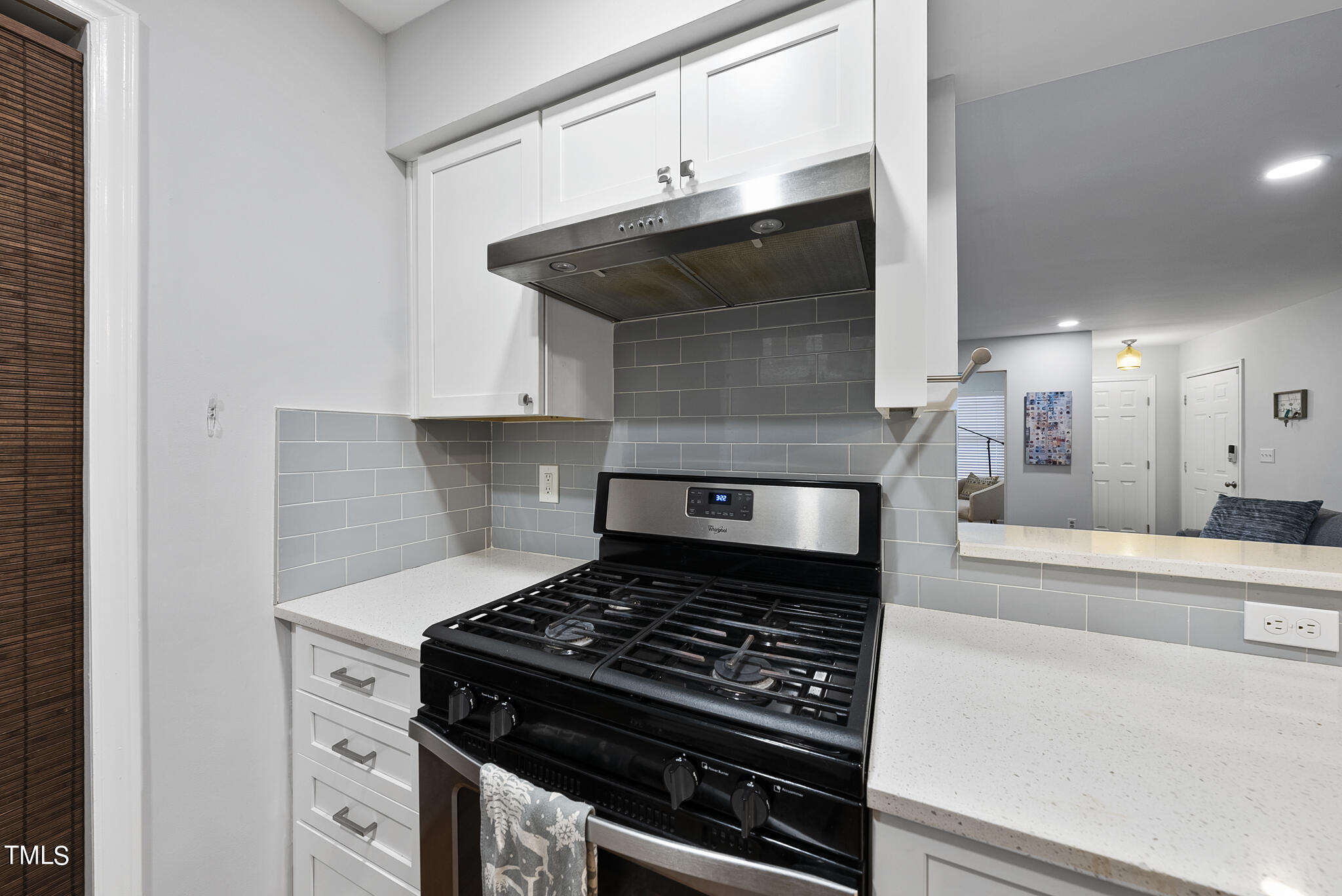 1309 Hillbrow Lane, Unit 103 Raleigh, NC 27615 - Photo 10 of 25 a stove top oven sitting inside of a kitchen