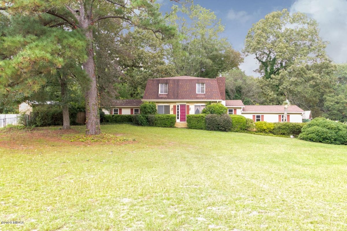 6663 Goodall Mill Road Macon, GA 31216 - Photo 1 of 31 a front view of a house with a yard and a large tree