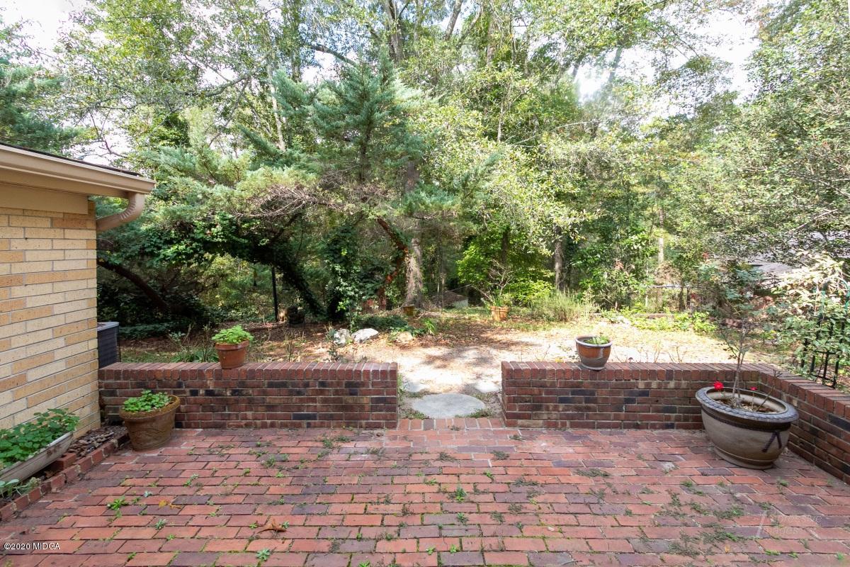 6663 Goodall Mill Road Macon, GA 31216 - Photo 30 of 31 a view of a backyard with plants and trees
