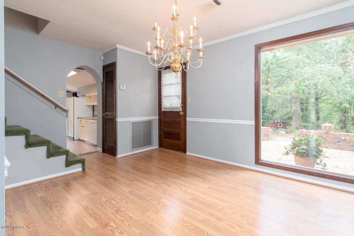 6663 Goodall Mill Road Macon, GA 31216 - Photo 6 of 31 a view of a big room with windows and chandelier