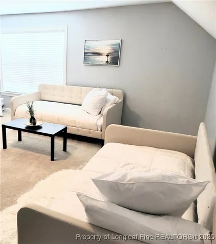 a living room with furniture and a couch