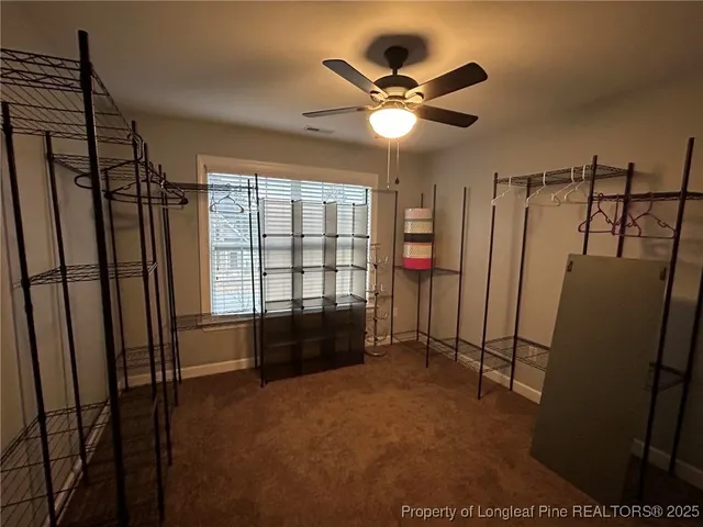 a bedroom with a bed and a chair