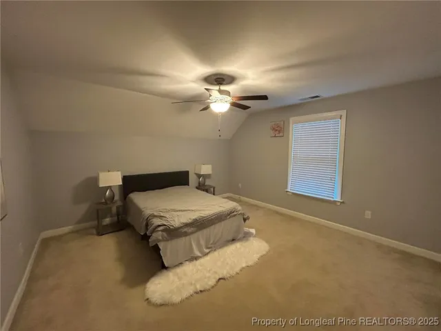 a balcony with wooden floor table and chairs