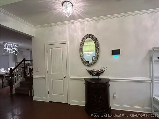 a view of a livingroom with furniture and wooden floor