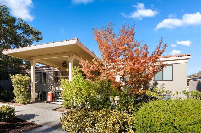 a view of a house with a tree