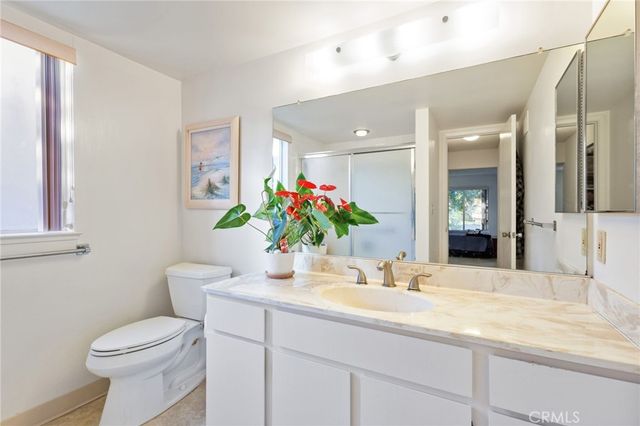 a bathroom with a glass shower door