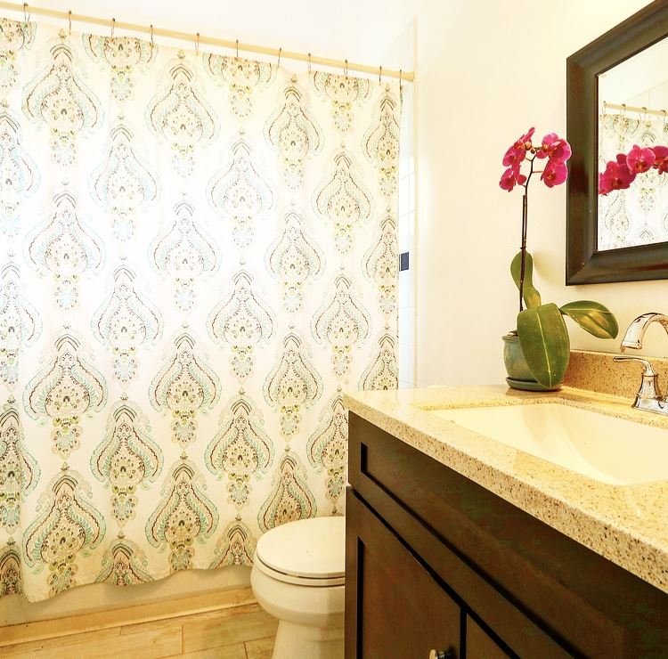 1001 Kauhikoa Road Haiku, HI 96708 - Photo 15 of 30 a bathroom with a granite countertop sink and a mirror