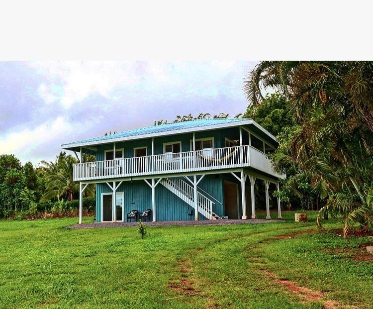1001 Kauhikoa Road Haiku, HI 96708 - Photo 16 of 30 a front view of a house with a garden