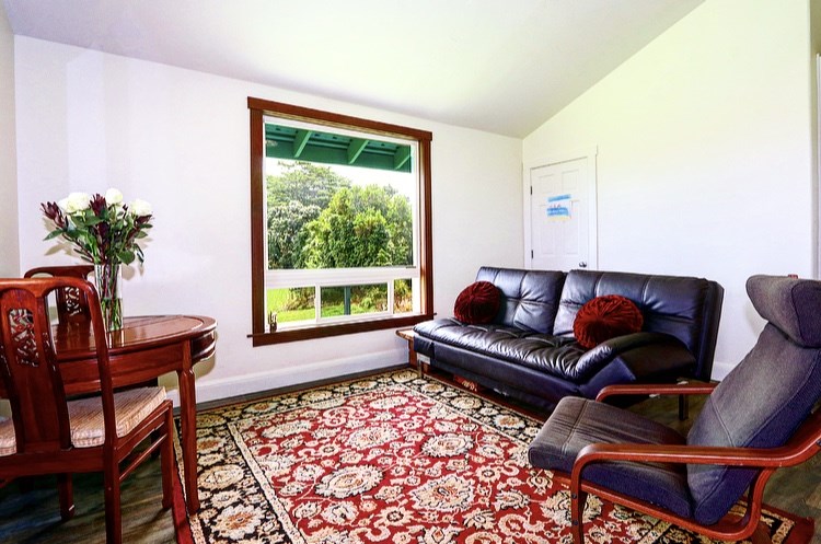 1001 Kauhikoa Road Haiku, HI 96708 - Photo 20 of 30 a living room with furniture and a window