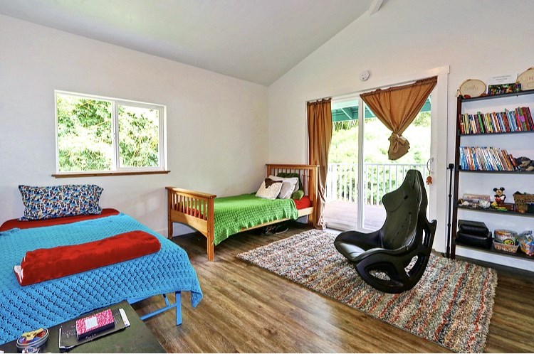 1001 Kauhikoa Road Haiku, HI 96708 - Photo 26 of 30 a bedroom with furniture and a window