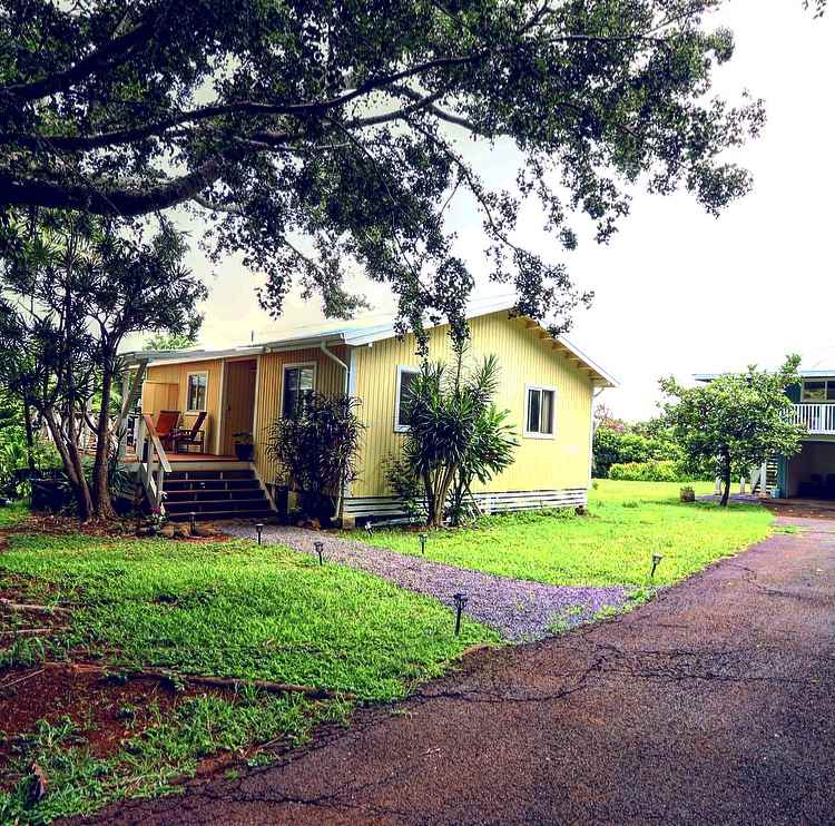 1001 Kauhikoa Road Haiku, HI 96708 - Photo 3 of 30 a view of a house with a yard and large tree