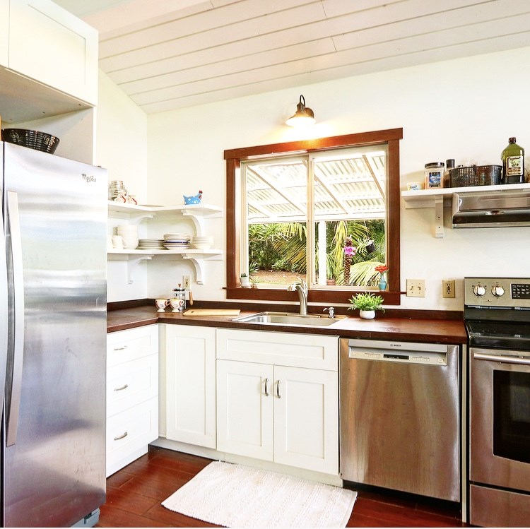1001 Kauhikoa Road Haiku, HI 96708 - Photo 9 of 30 a kitchen with a sink window and cabinets