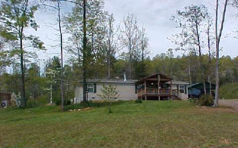 155 Hall Place Road Murphy, NC 28906 - Photo 1 of 1 a view of a house with backyard and trees