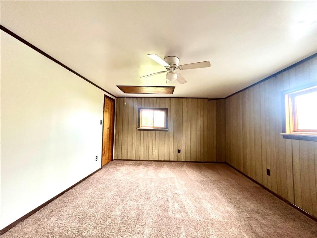 301 4th Street Allison, PA 15413 - Photo 18 of 29 an empty room with a ceiling fan and windows