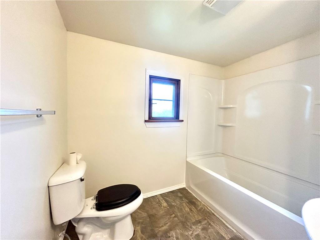 301 4th Street Allison, PA 15413 - Photo 23 of 29 a bathroom with a toilet and a bathtub