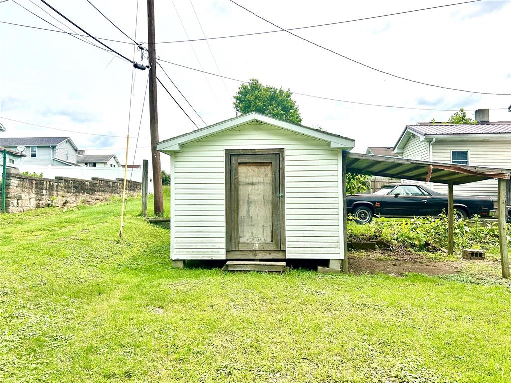 301 4th Street Allison, PA 15413 - Photo 29 of 29 a front view of a house with a yard
