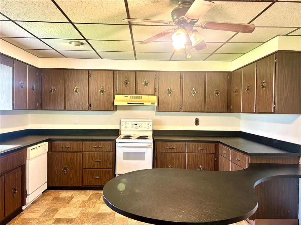 301 4th Street Allison, PA 15413 - Photo 3 of 29 a kitchen with wooden cabinets and sink