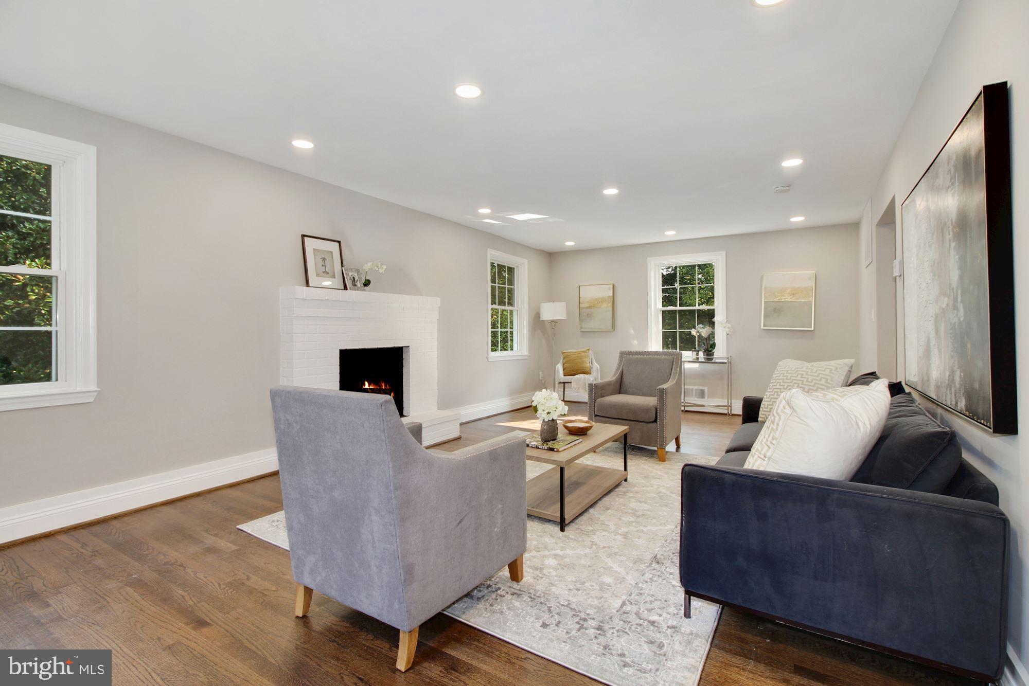 7003 Kenleigh Road Baltimore, MD 21212 - Photo 1 of 28 a living room with furniture and a fireplace
