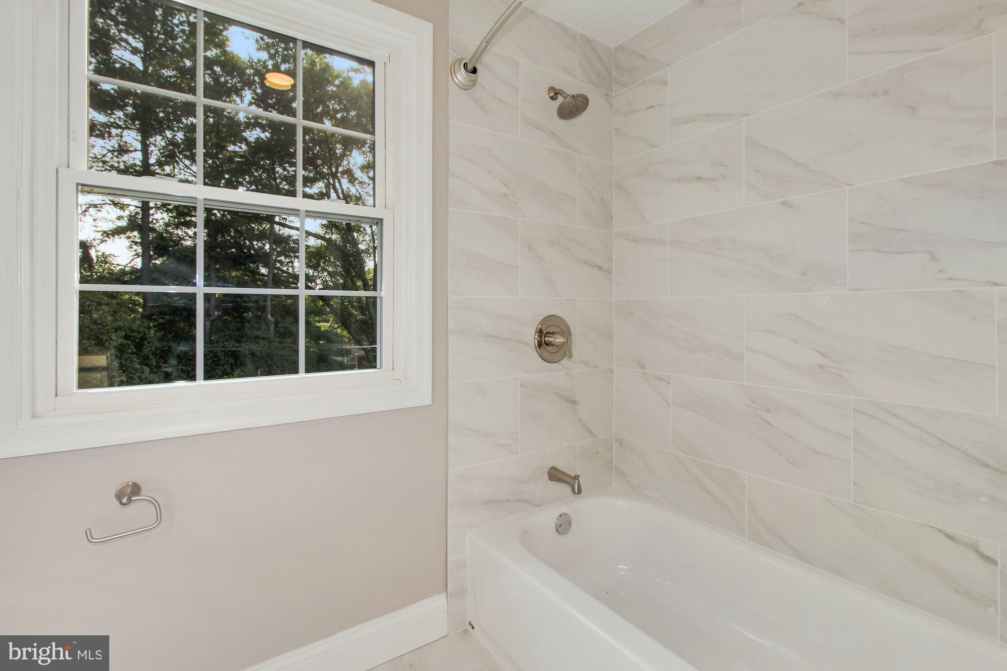 7003 Kenleigh Road Baltimore, MD 21212 - Photo 13 of 28 a bathroom with a bathtub