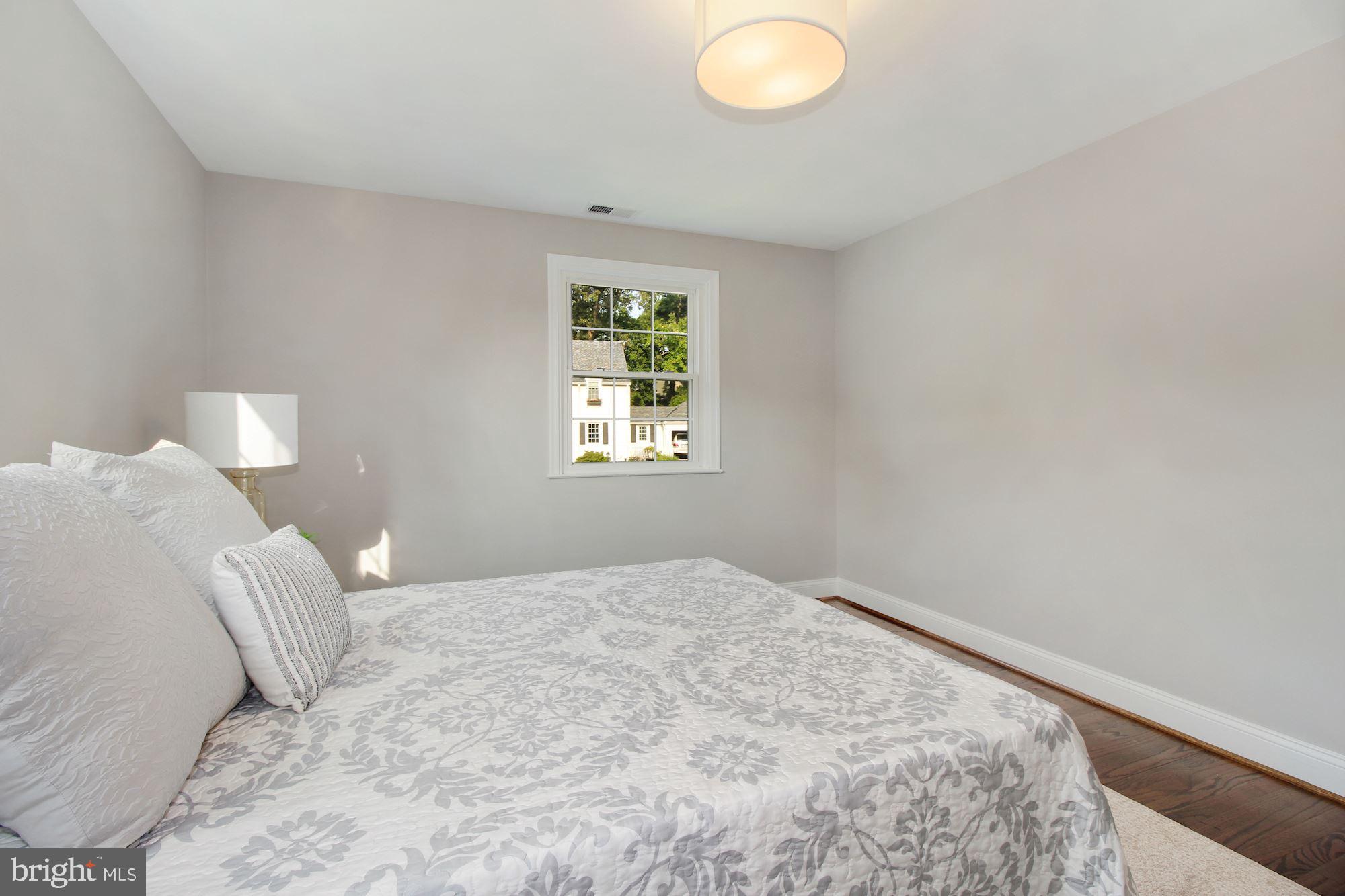 7003 Kenleigh Road Baltimore, MD 21212 - Photo 14 of 28 a bedroom with a bed and a window