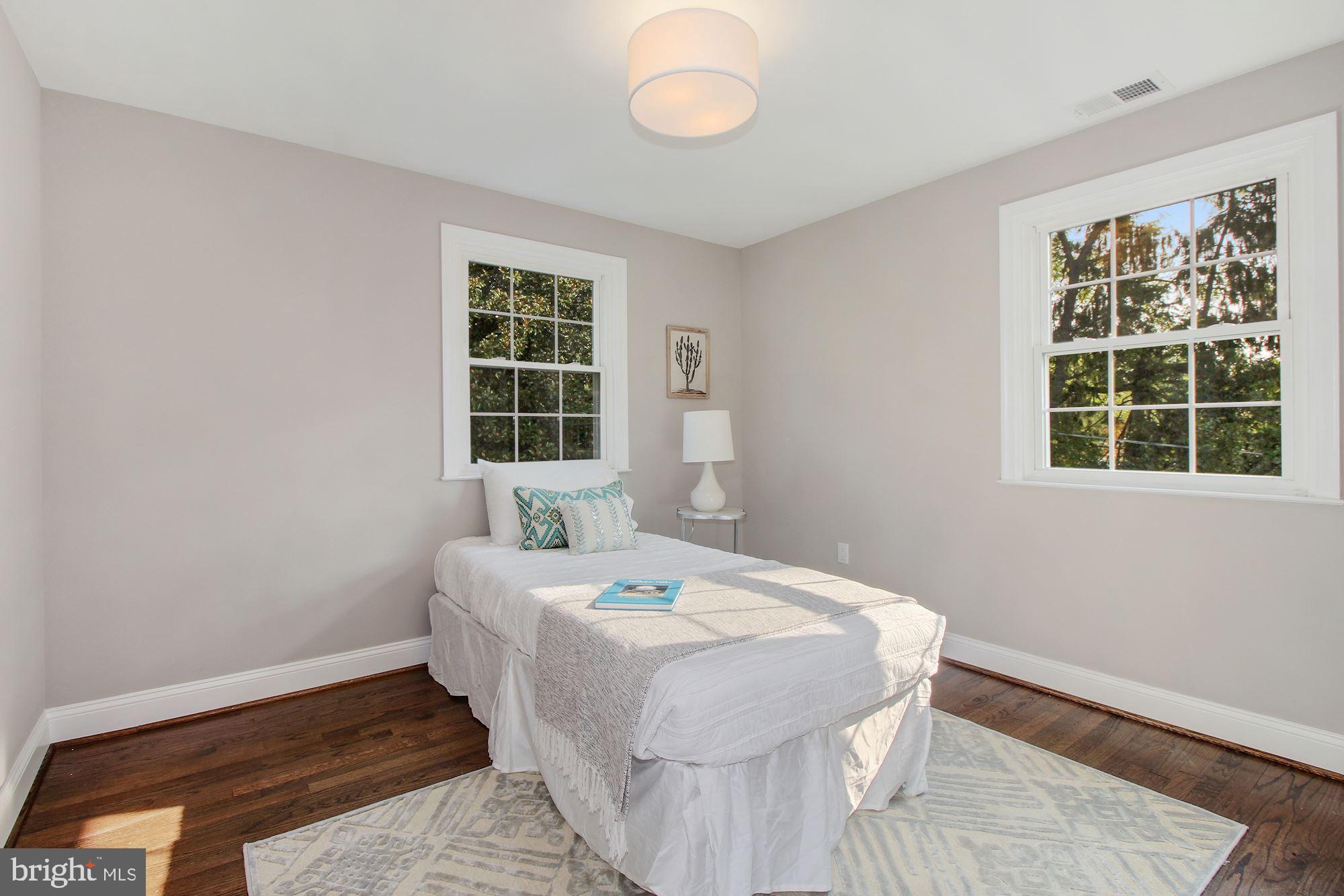 7003 Kenleigh Road Baltimore, MD 21212 - Photo 15 of 28 a bedroom with a bed and a window