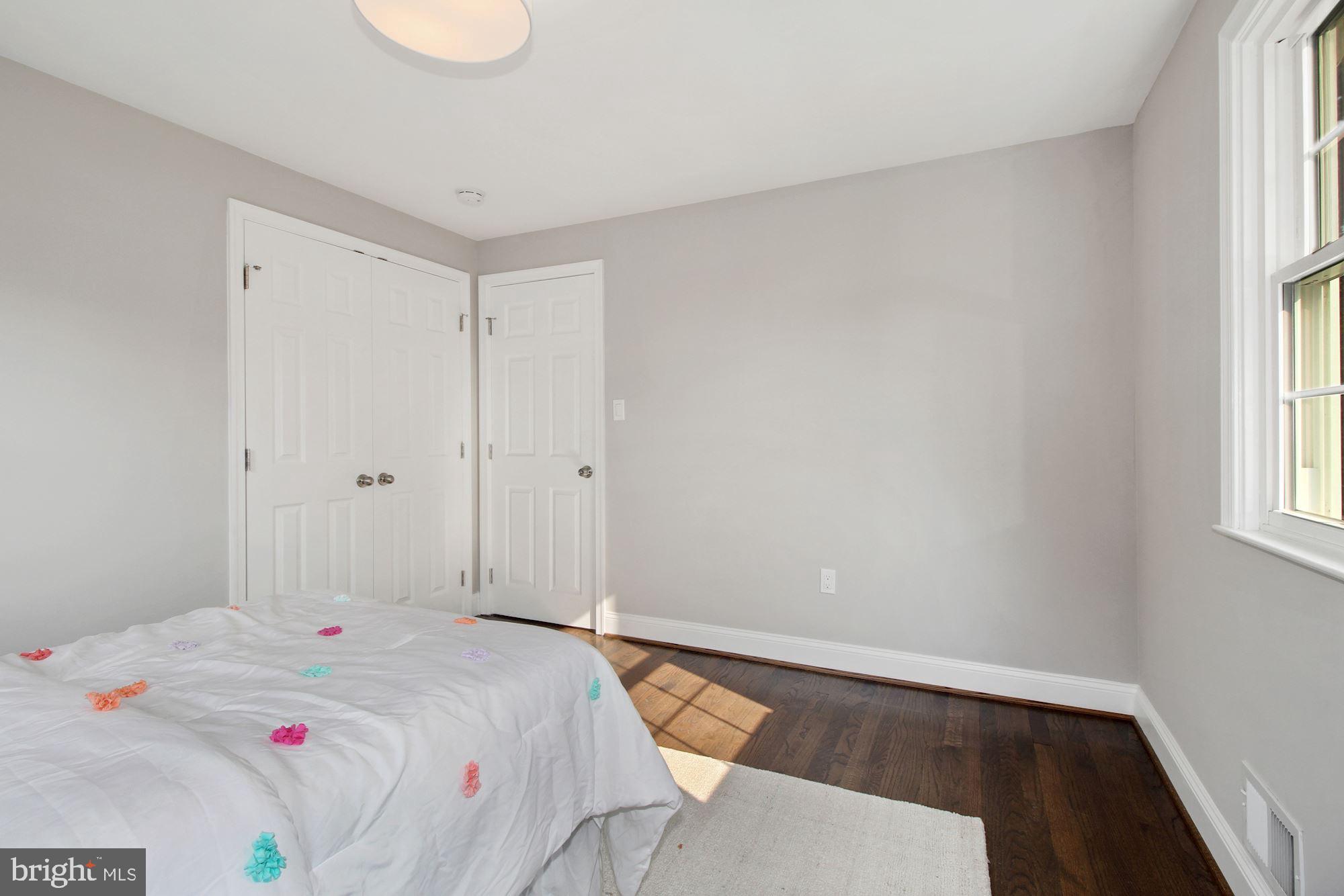 7003 Kenleigh Road Baltimore, MD 21212 - Photo 18 of 28 a bedroom with a bed and a window