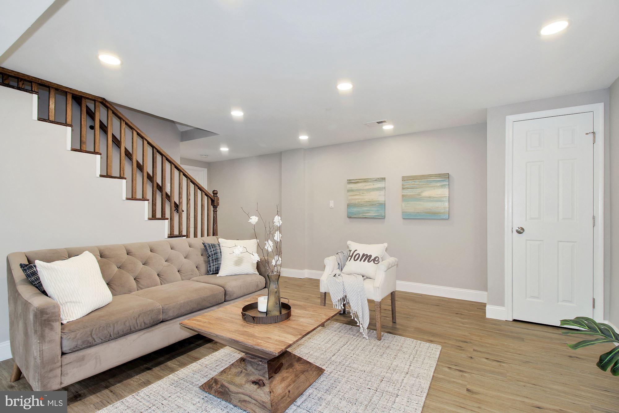 7003 Kenleigh Road Baltimore, MD 21212 - Photo 19 of 28 a living room with furniture and wooden floor