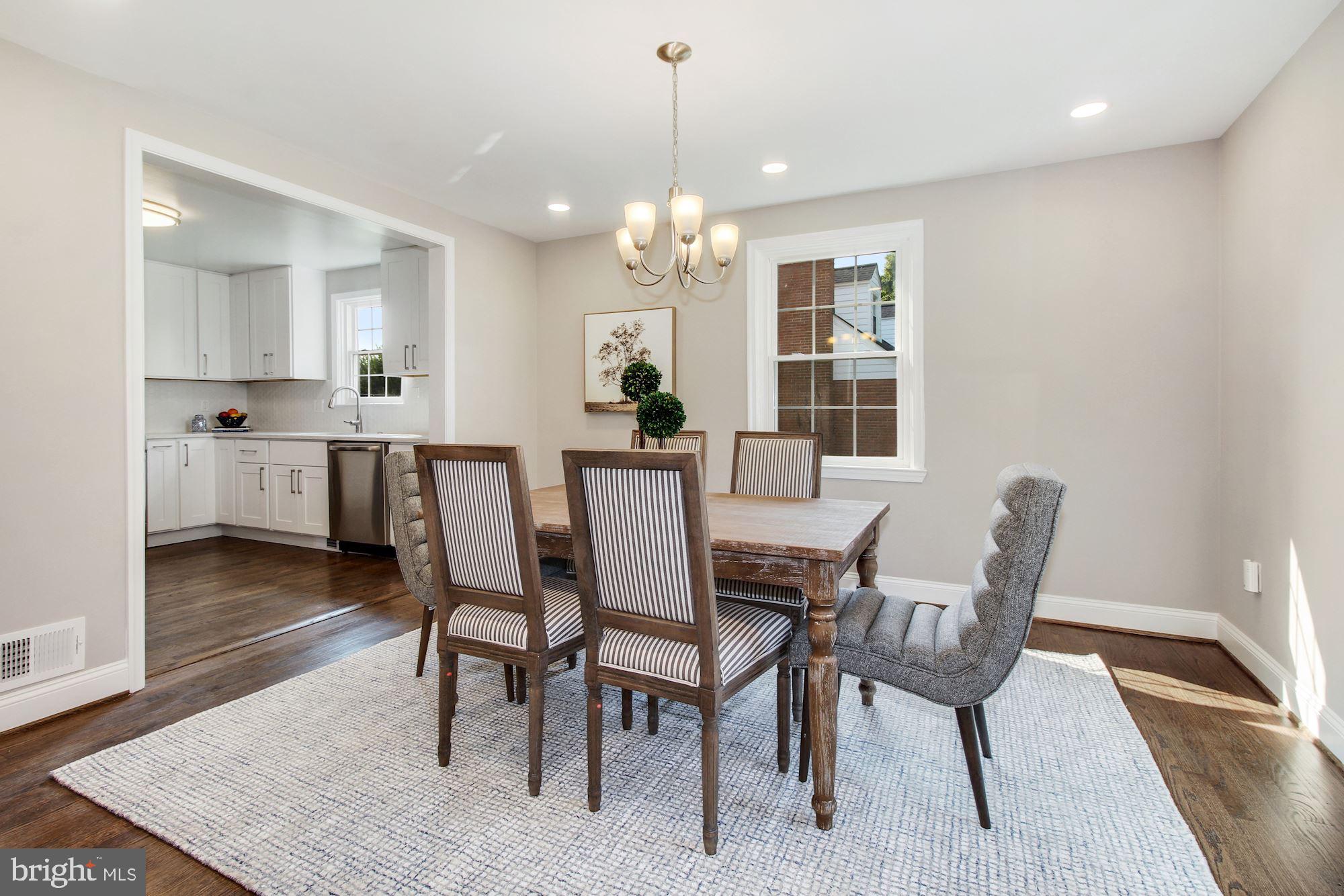 7003 Kenleigh Road Baltimore, MD 21212 - Photo 2 of 28 a view of a dining room with furniture and wooden floor