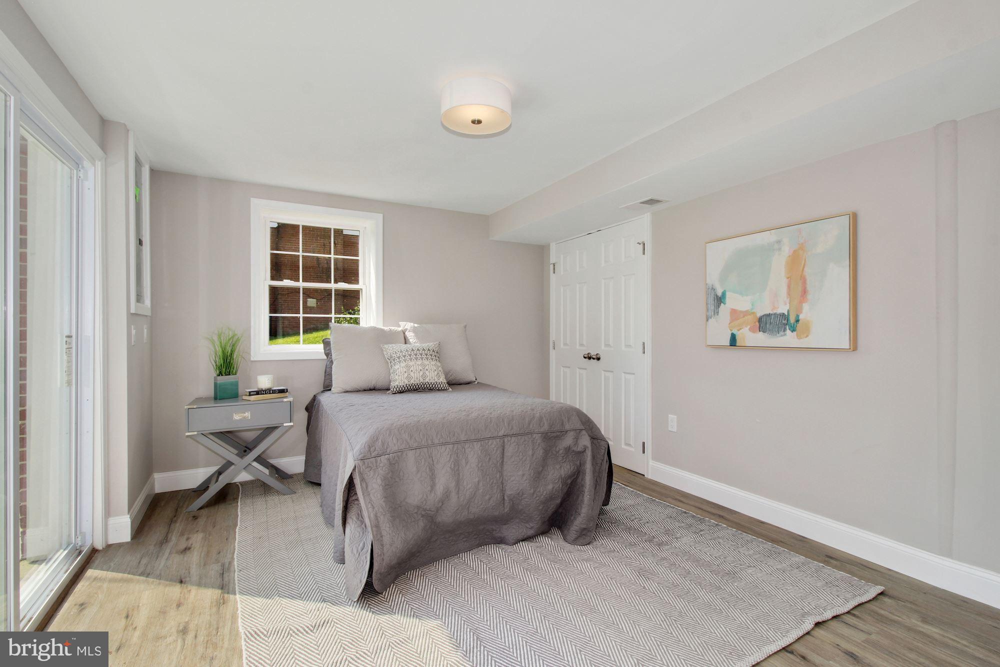 7003 Kenleigh Road Baltimore, MD 21212 - Photo 22 of 28 a bedroom with a bed and a window