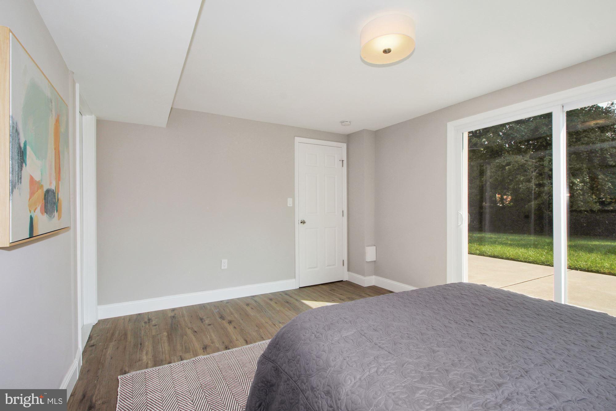 7003 Kenleigh Road Baltimore, MD 21212 - Photo 23 of 28 a bedroom with a bed and a large window