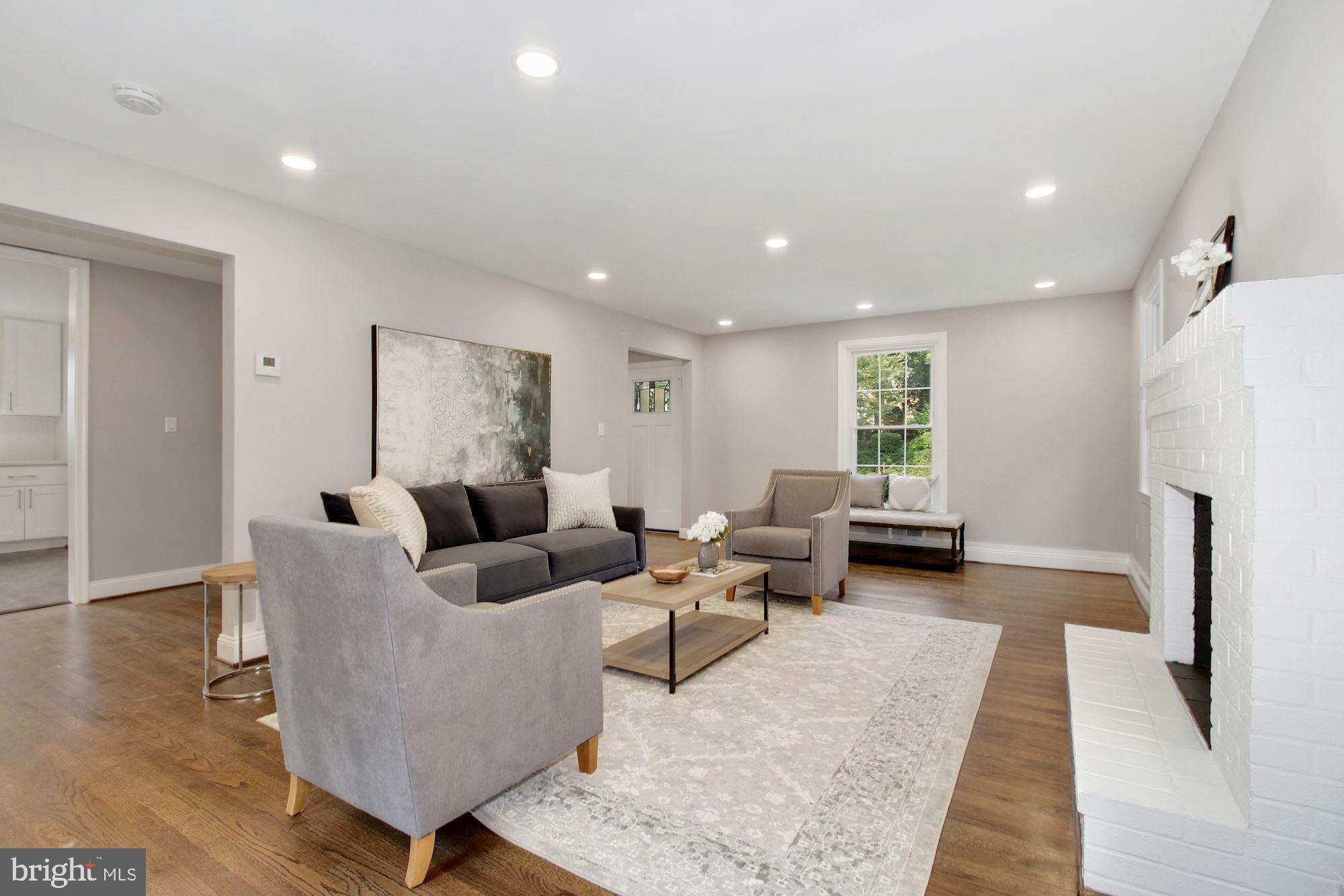 7003 Kenleigh Road Baltimore, MD 21212 - Photo 4 of 28 a living room with furniture wooden floor and a table