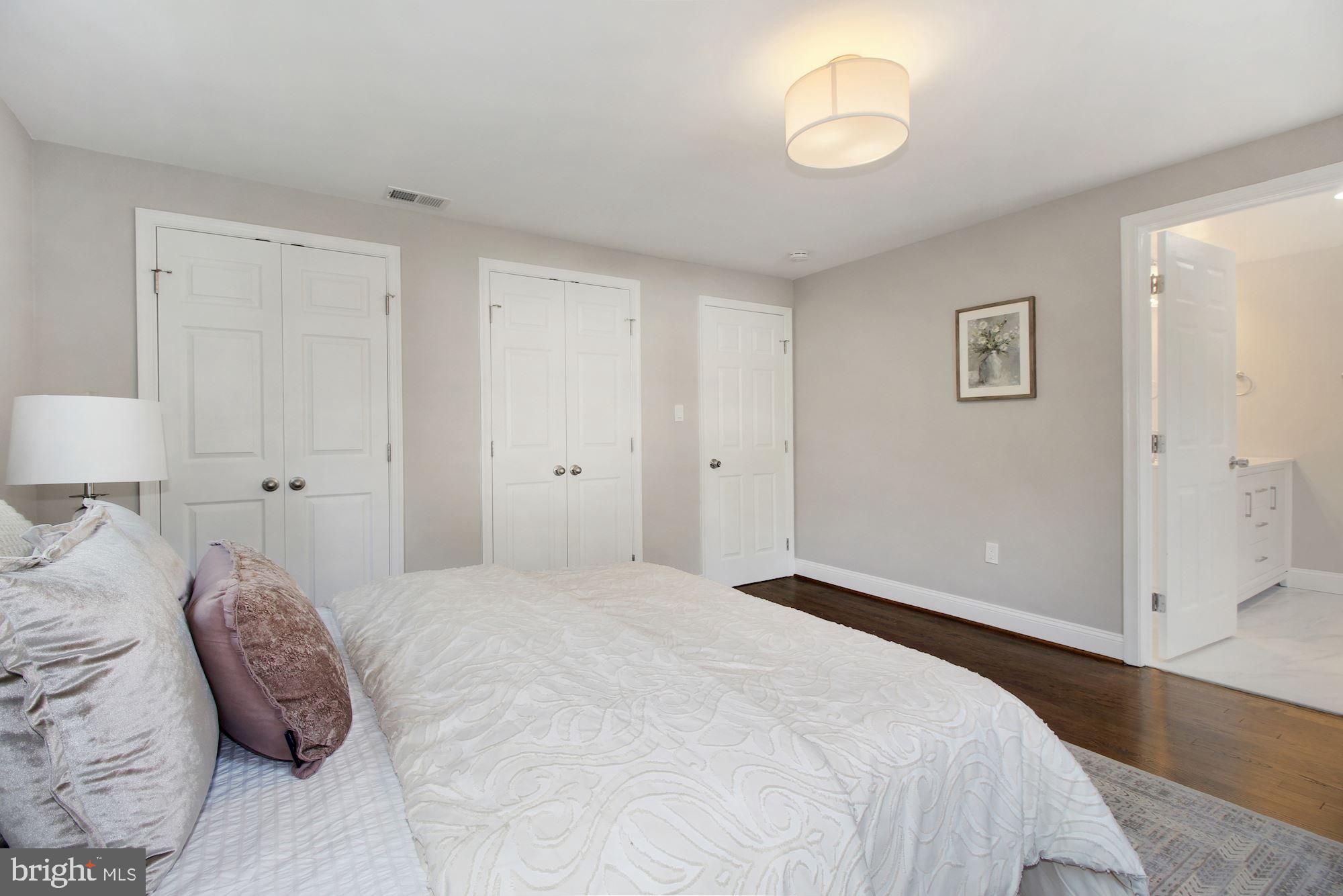 7003 Kenleigh Road Baltimore, MD 21212 - Photo 7 of 28 a bedroom with a bed and a lamp