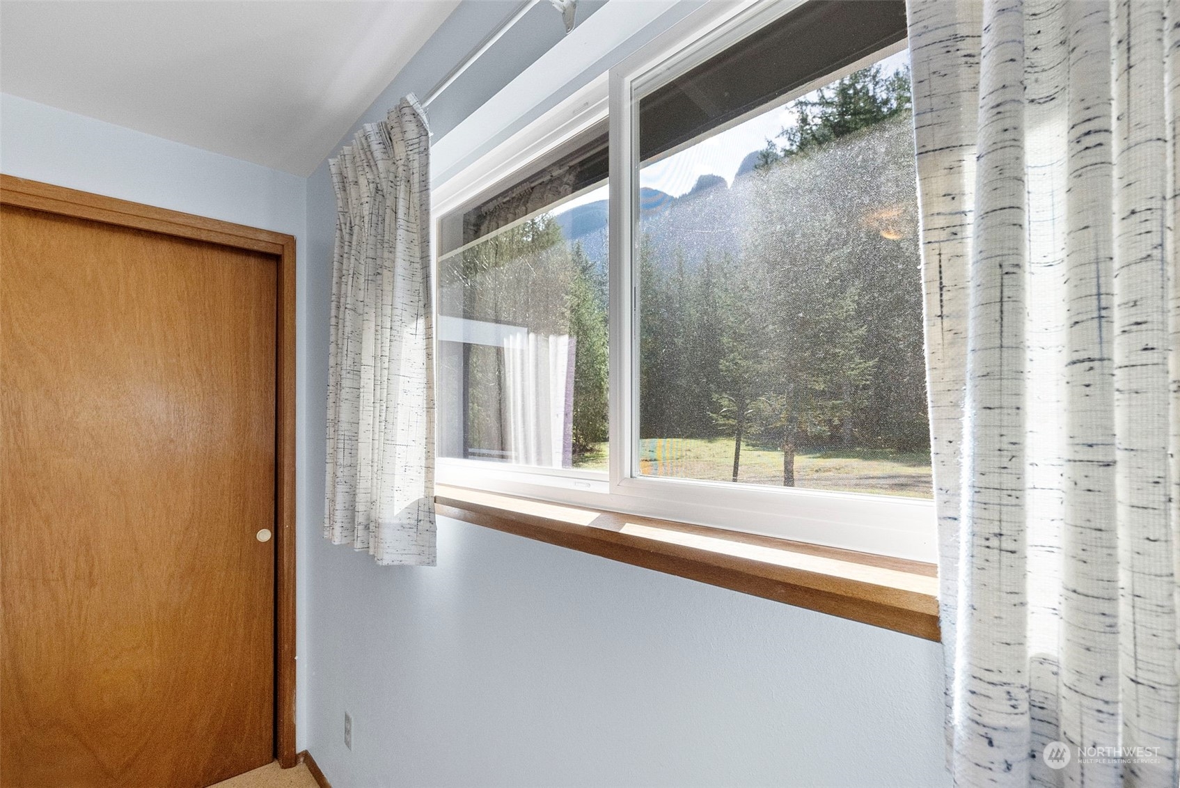 44223 Southeast Ernies Grove Road Snoqualmie, WA 98065 - Photo 13 of 21 a view of a room with a large window and tub