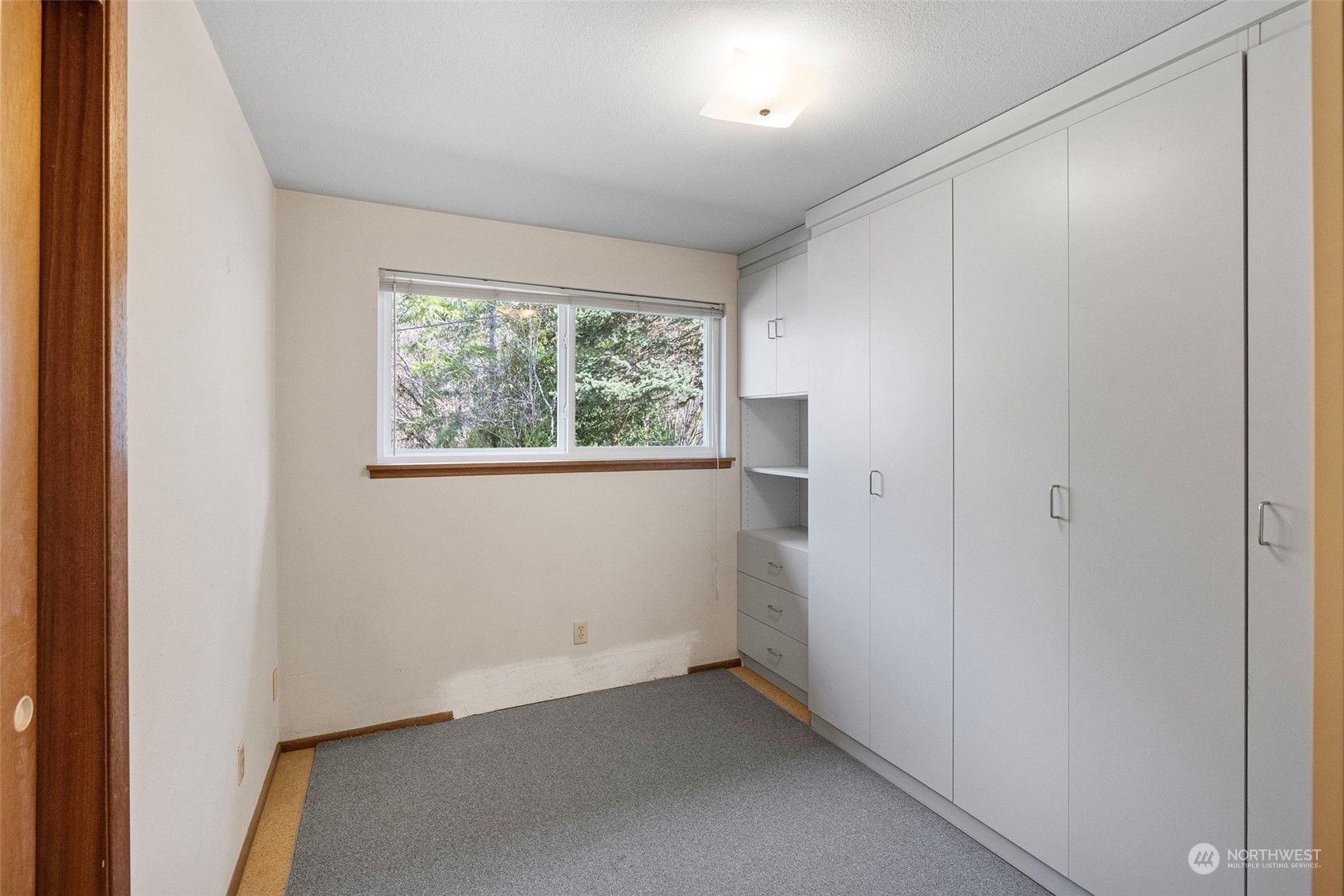 44223 Southeast Ernies Grove Road Snoqualmie, WA 98065 - Photo 15 of 21 an empty room with a windows and closet